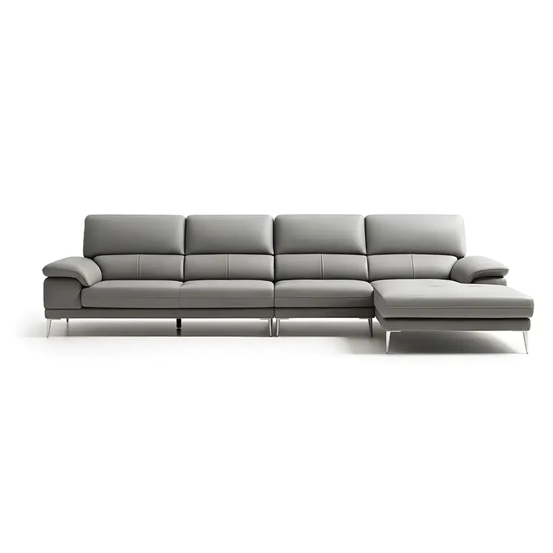 sofa features broad padded armrests with layered cushion detailing,