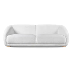 Boucle sofa with thick rounded arms and natural wooden legs, curved profile detail