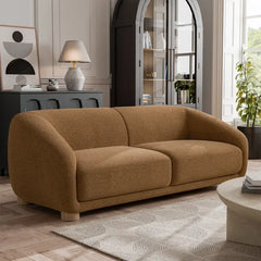 Boucle sofa with thick rounded arms and natural wooden legs, left-side view