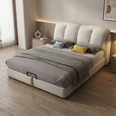 hydraulic bed with storage shown in a spacious bed layout with oversized padded headboard