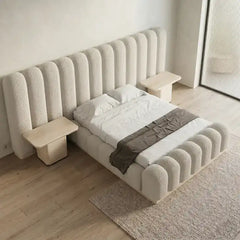 luxury bed shown in a spacious bed layout with soft textured fabric