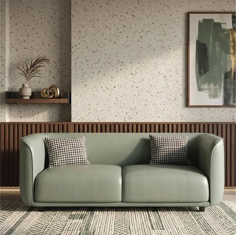 Curved sofa with soft rounded arms and low wraparound backrest, straight front view