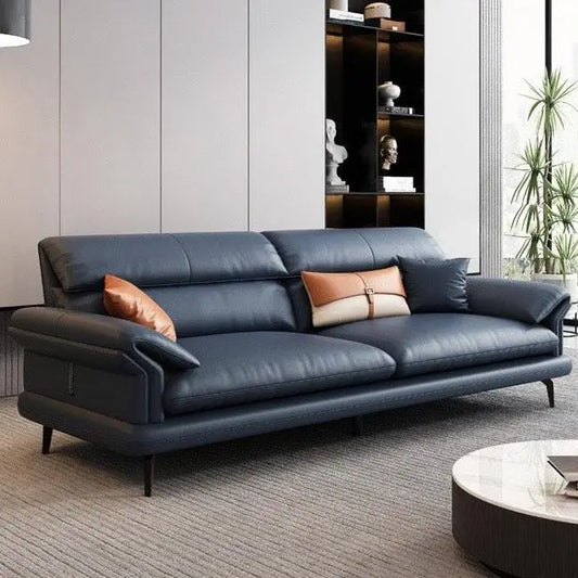 leatherette sofa with wide pillow-top armrests and thick back cushions, three-quarter view