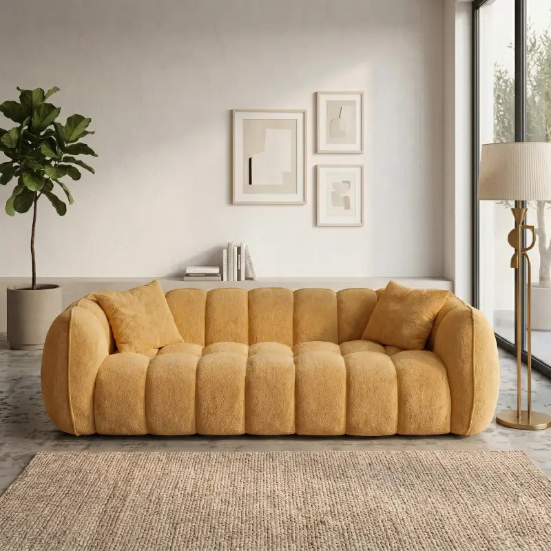 3 seater fabric sofa with vertical stitched cushions across the back and arms, three-quarter view