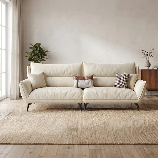 Fabric sofa with soft curved arms and slim metal legs, straight front view
