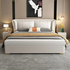 wingback bed shown with a balanced mattress layout with wide padded headboard