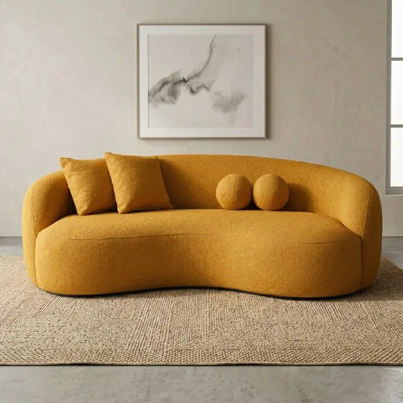 Lounge sofa with deep lounge seating and rounded arms, straight front view