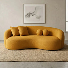 Lounge sofa with deep lounge seating and rounded arms, straight front view