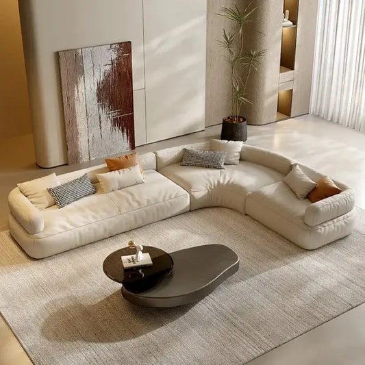 Corner sofa with spacious five-seater curved layout, front three-quarter view