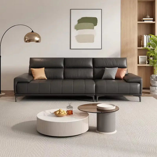 Leatherette sofa with deep cushions and segmented back support, straight front view