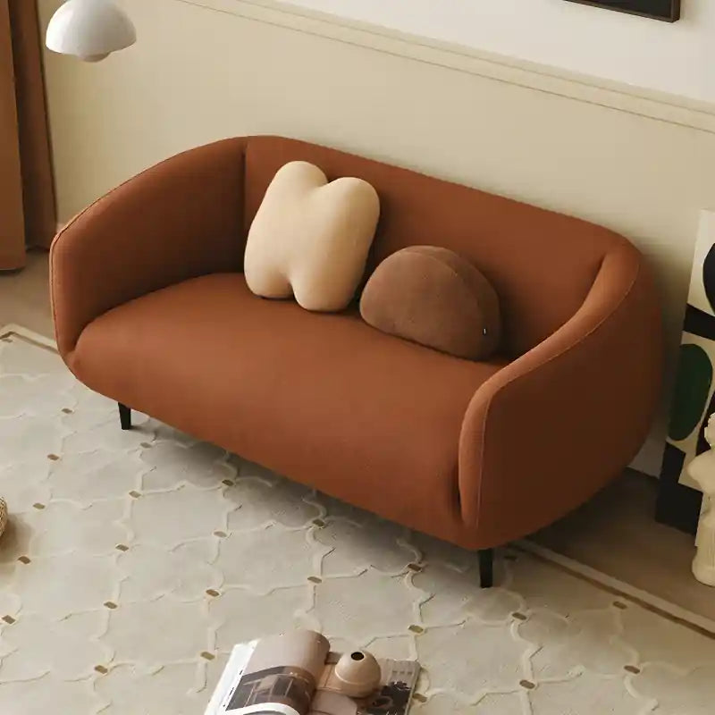 Luxury sofa with wraparound backrest and compact seating, straight front view