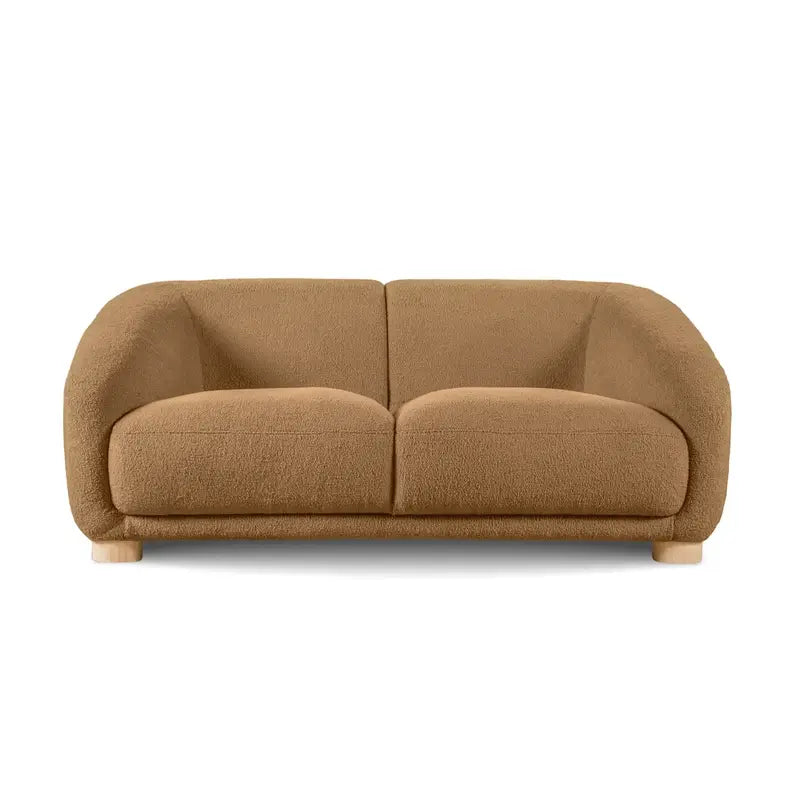 Boucle sofa with thick rounded arms and natural wooden legs, close-up of back cushions