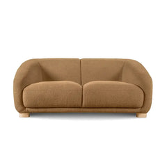 Boucle sofa with thick rounded arms and natural wooden legs, close-up of back cushions