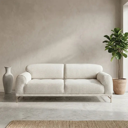 L shape sofa with rounded cushioned arms and metallic legs, straight front view