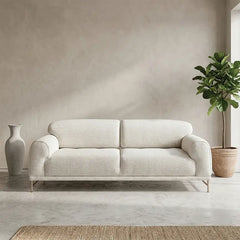 L shape sofa with rounded cushioned arms and metallic legs, straight front view