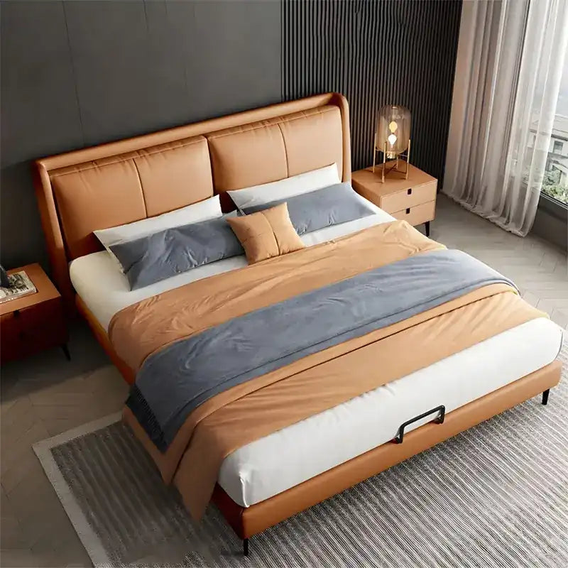 upholstered bed shown in a spacious bed layout with wide padded headboard