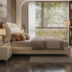 tufted bed shown in a spacious bed layout with stitched padded headboard