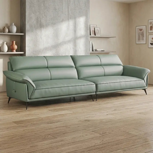 Leatherette sofa with deep lounge seating and soft back cushions, left-side view