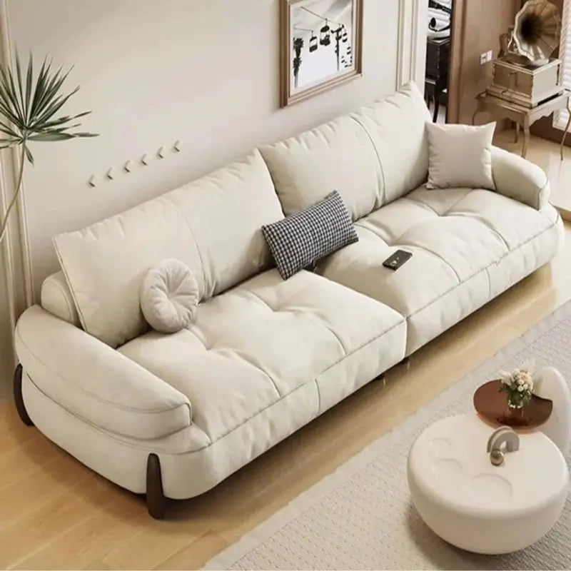 plush sofa with segmented seat cushions with vertical stitching, side profile