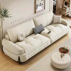 plush sofa with segmented seat cushions with vertical stitching, side profile