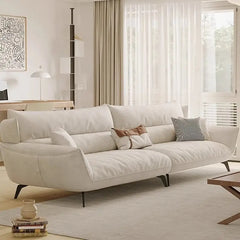 L shape sofa with soft curved arms and slim metal legs, left-side view