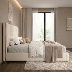 upholstered bed shown in a spacious bed layout with tall padded headboard