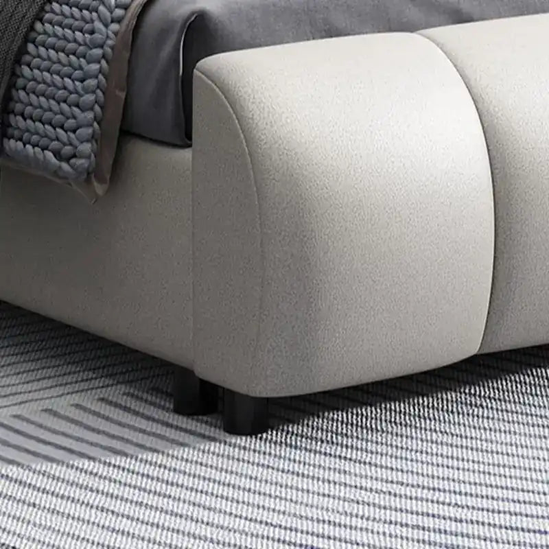 upholstered bed with hydraulic storage shown with a balanced mattress layout with curved padded headboard alternate front ang