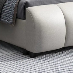 upholstered bed with hydraulic storage shown with a balanced mattress layout with curved padded headboard alternate front ang