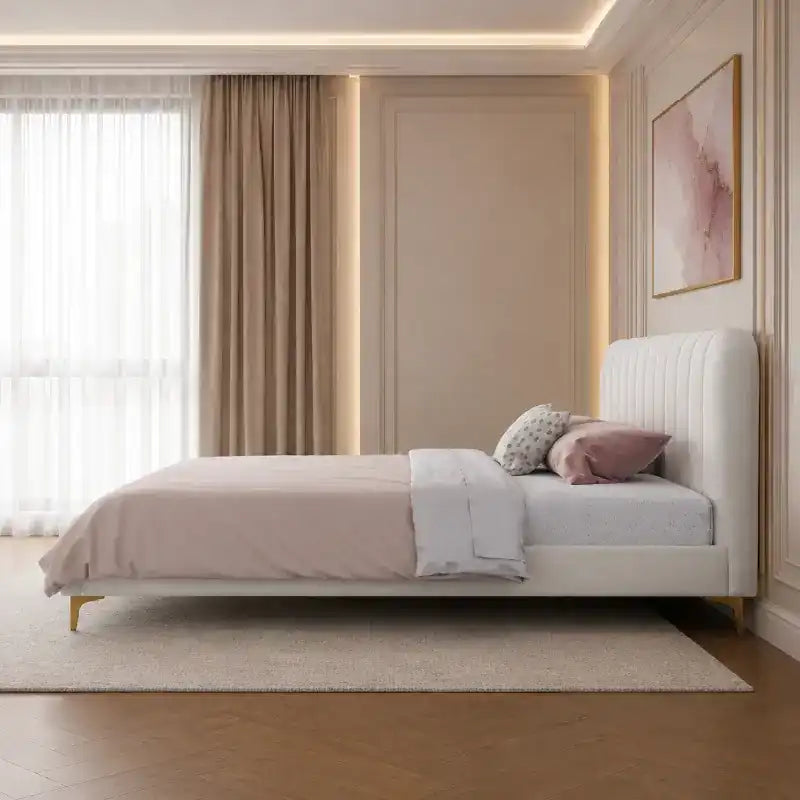minimalist platform bed shown in a spacious bed layout with rounded padded edges