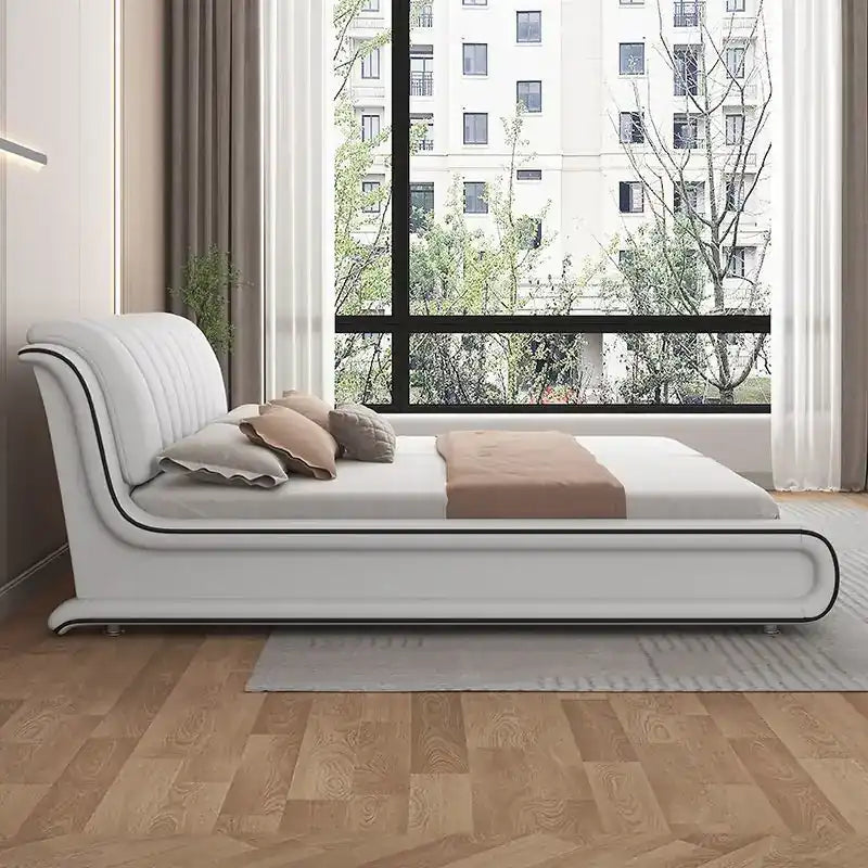 upholstered bed showing the lift-up storage area with curved padded headboard