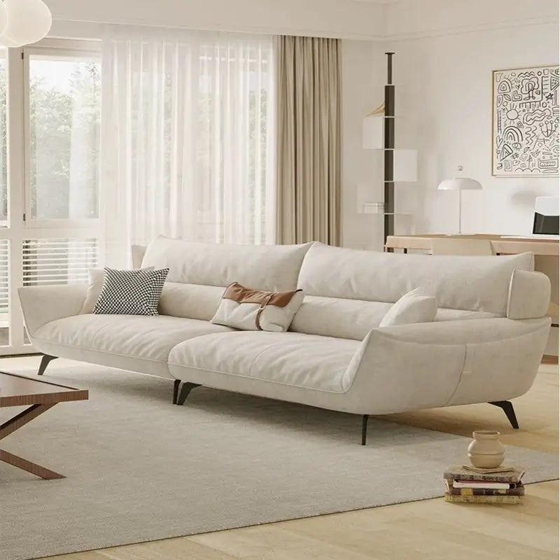 Fabric sofa with soft curved arms and slim metal legs, right-side view
