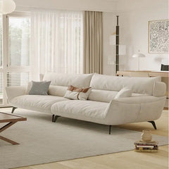 Fabric sofa with soft curved arms and slim metal legs, right-side view