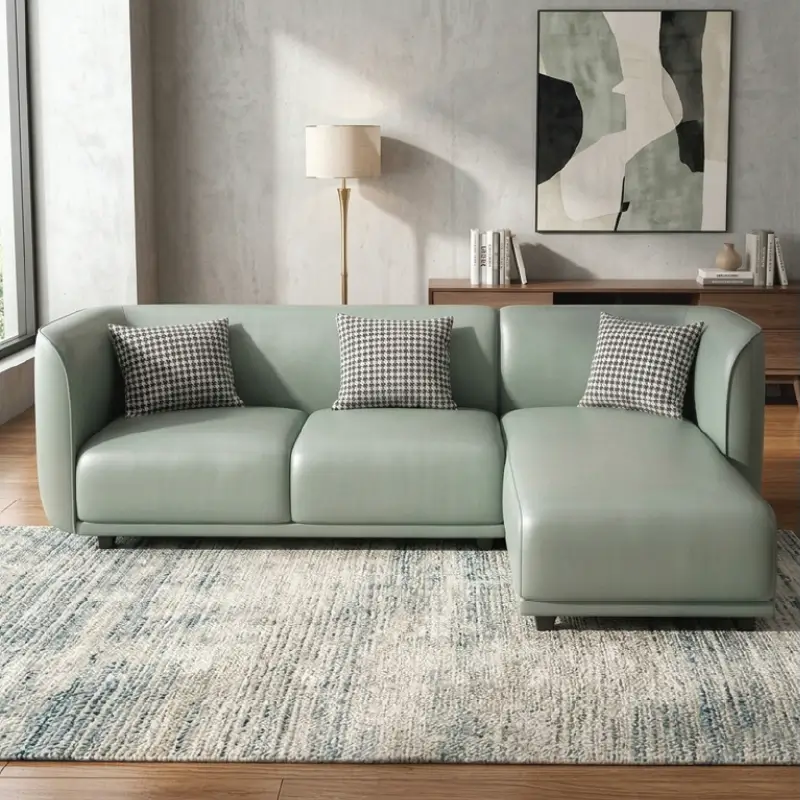 Curved sofa with soft rounded arms and low wraparound backrest, right-side view
