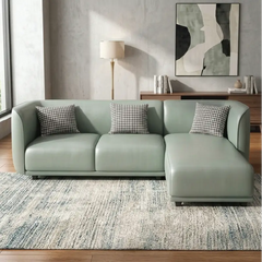 Curved sofa with soft rounded arms and low wraparound backrest, right-side view
