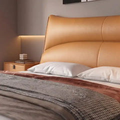 modern luxury bed front view showing the complete bed frame with wide padded headboard