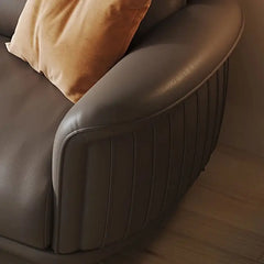 Genuine leather upholstery in earth-toned hues like taupe and caramel complements both minimalist and luxury interiors.