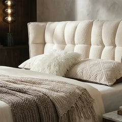upholstered bed with storage shown with a balanced mattress layout with thick padded headboard