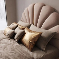 king size bed shown with a balanced mattress layout with shell-shaped padded headboard