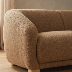 Fabric sofa with thick rounded arms and natural wooden legs, full seating layout