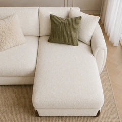 Corner sofa with curved arms and wooden accent details, full seating layout