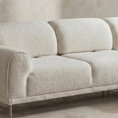 L shape sofa with rounded cushioned arms and metallic legs, right-side view