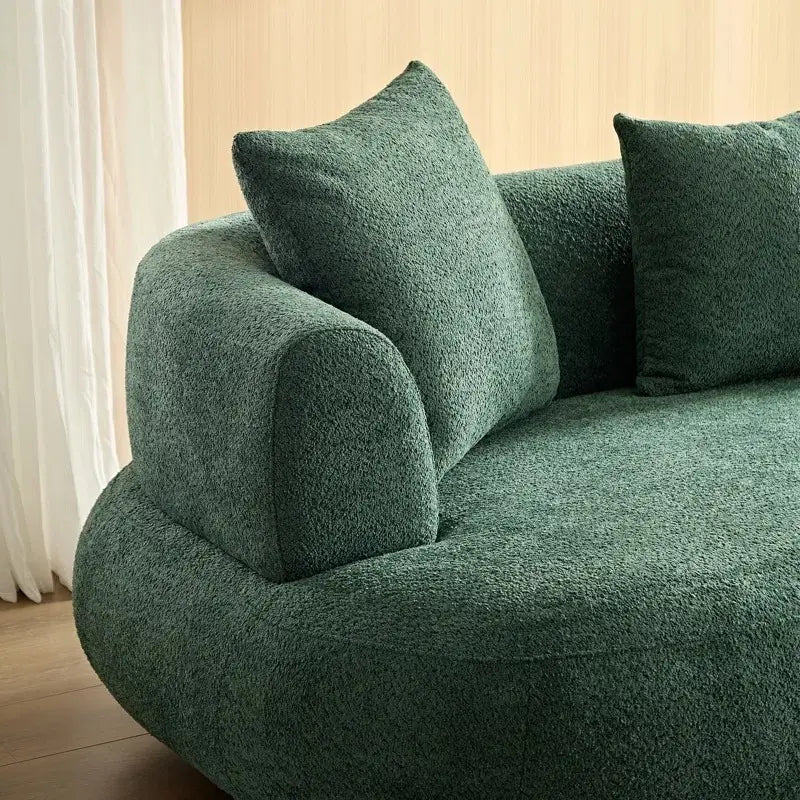 lounge sofa with soft rounded silhouette and sculptural form, armrest close-up