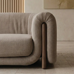 fabric sofa with front view with wide three-person proportions, armrest close-up