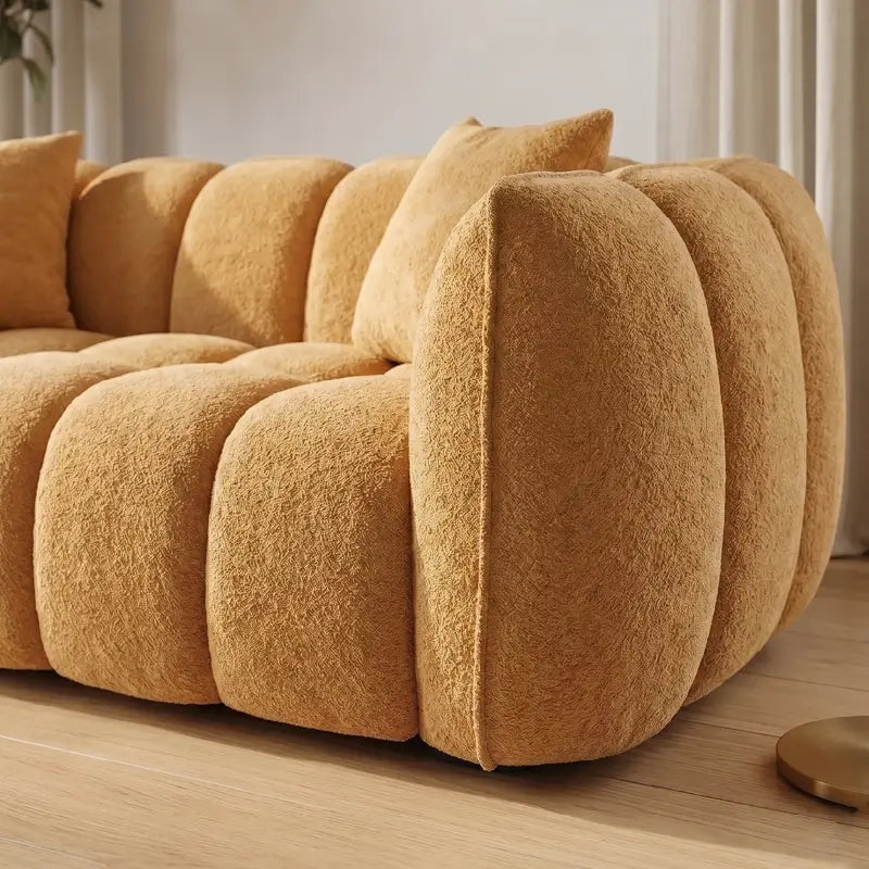 boucle sofa with textured fabric finish and tailored seams, armrest close-up