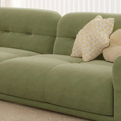 cloud sofa with a curved backrest, sage green upholstery and hidden low legs