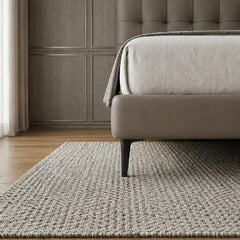 bed with tufted headboard shown in a spacious bed layout with button-padded headboard