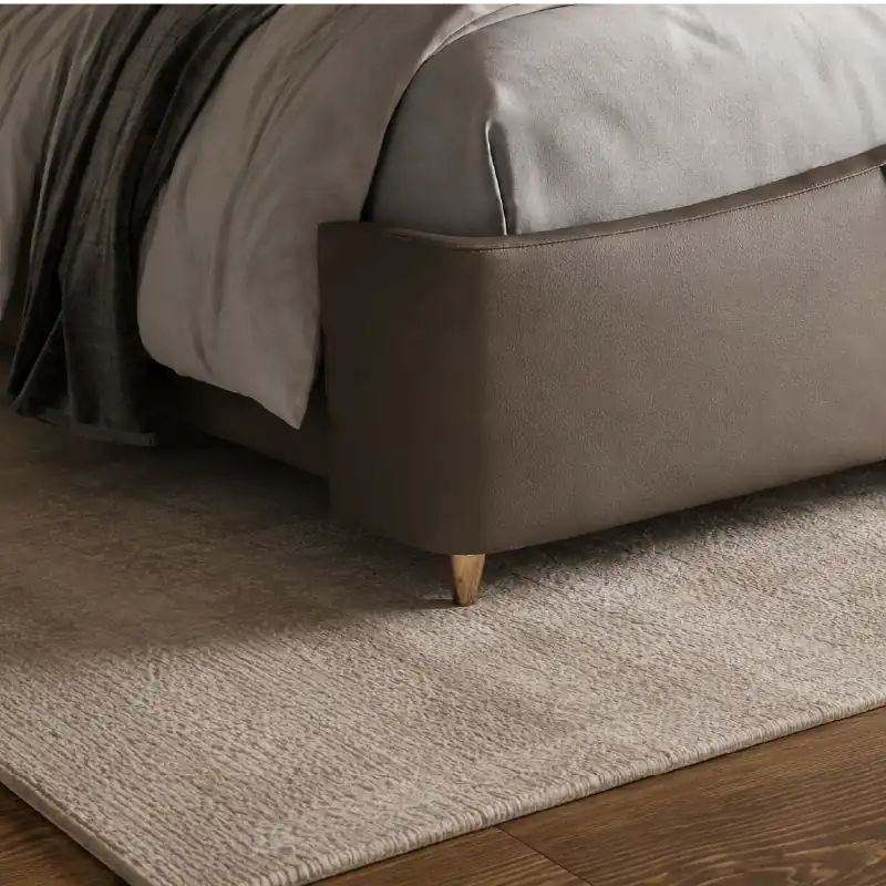 bed with tufted headboard side profile with cushioned frame edges with button-padded headboard