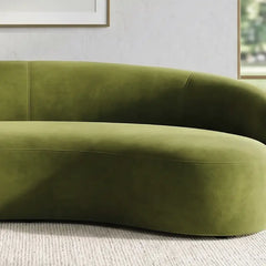Curved sofa with wraparound backrest and deep bench seating, close-up of back cushions