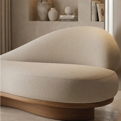 Lounge sofa with curved wooden base and asymmetrical backrest, full seating layout