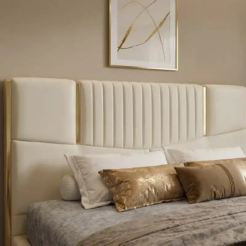 upholstered bed shown in a compact double-bed layout with tall padded headboard